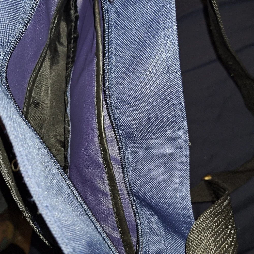 Stylish Blue and Black Men's Bag with Adjustable Strap and Side Bottle Holder
